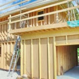 Construction d'une maison ossature bois avec isolation d'un toit plat